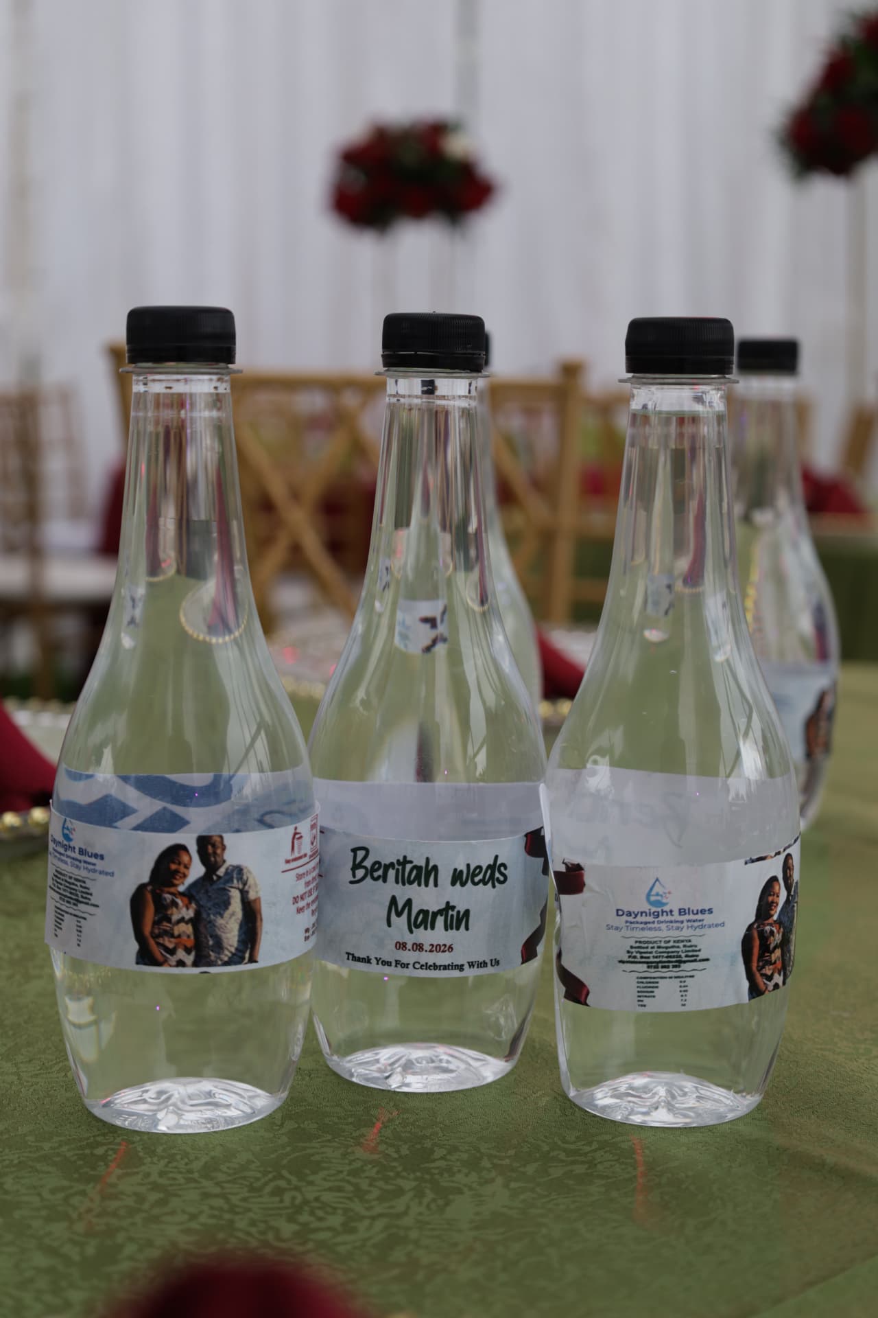 Daynight Blues bottles with personalised wedding labels on a reception table